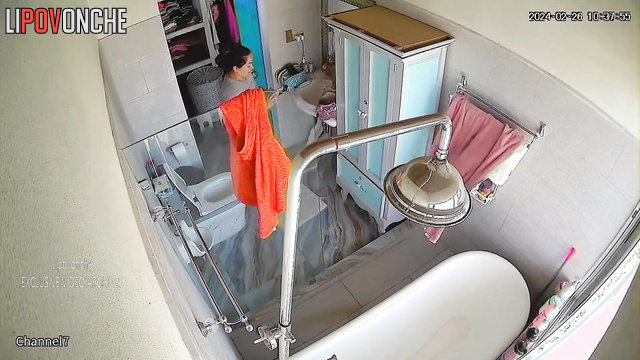 Brunette MILF with curvy shapes takes a bath and masturbates