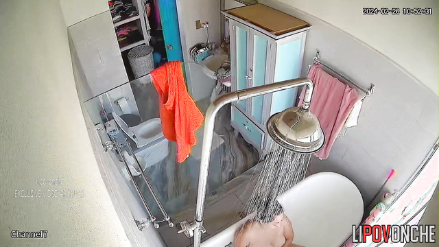 Brunette MILF with curvy shapes takes a bath and masturbates
