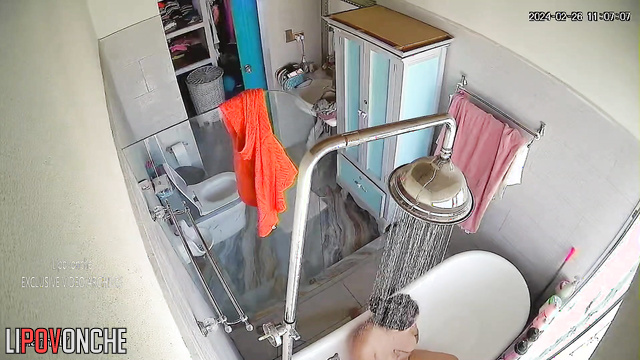 Brunette MILF with curvy shapes takes a bath and masturbates