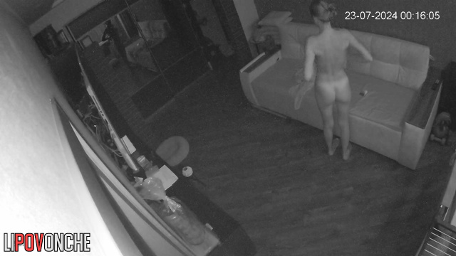 Skinny, beautiful, naked woman rubs herself with cream after a shower