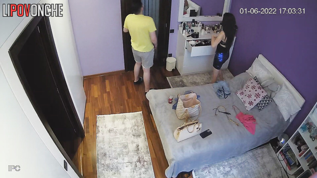Girl trying on clothes in the bedroom in front of the mirror
