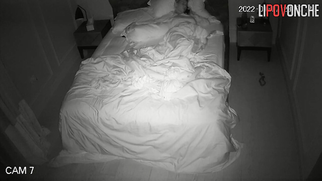 Skinny blonde with big tits has phone sex on bed in bedroom