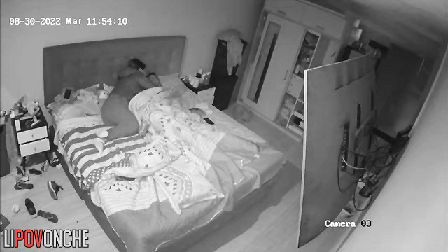 Curvy couple fucking on bed in bedroom in front of TV