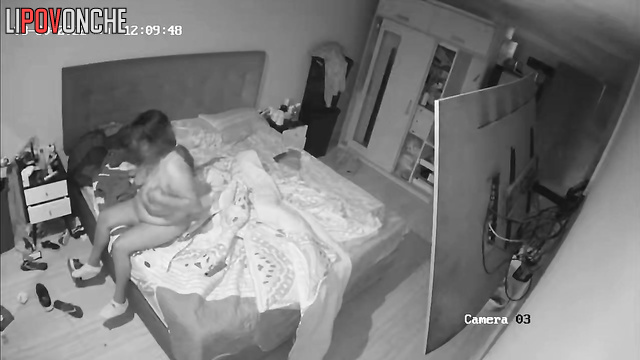 Curvy couple fucking on bed in bedroom in front of TV