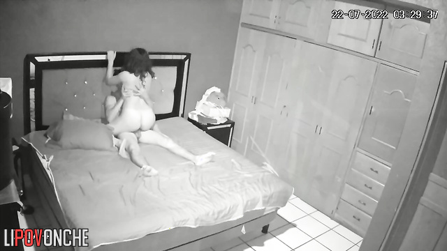 Stormy sex of a young couple on a bed in the bedroom