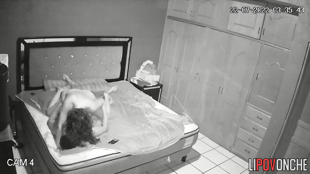 Stormy sex of a young couple on a bed in the bedroom
