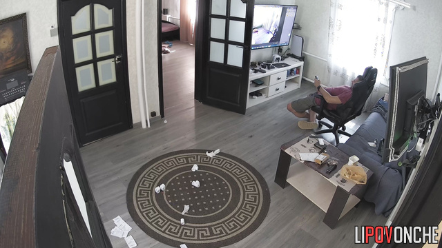 Man jerks off to his homemade porn in the living room