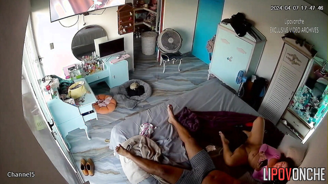 Curvy brunette rides her man's cock in front of the TV