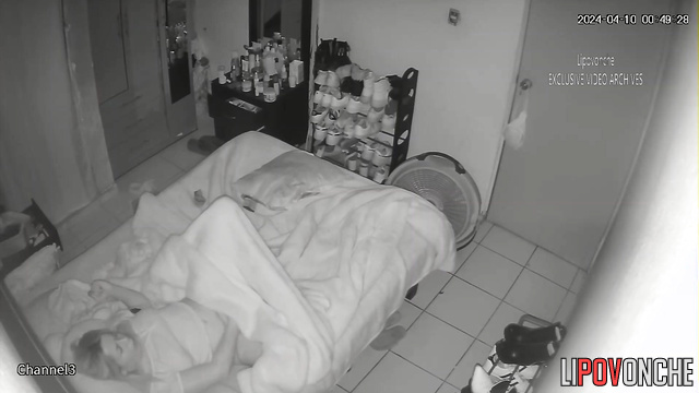 Sad blonde having fun with her fingers under the blanket