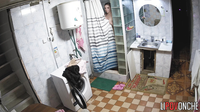 Blonde taking shower in the basement (she is almost naked)