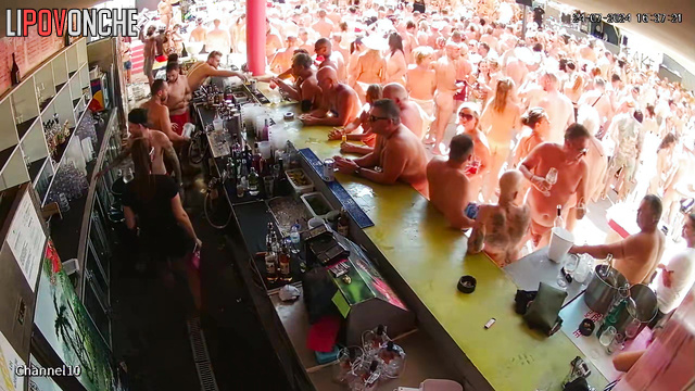 Swinger party with drinks, dancing and blowjobs near the bar