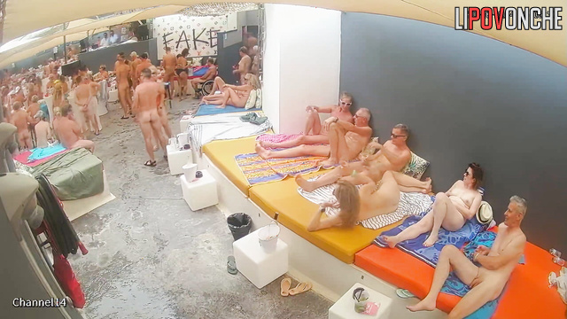 Different people enjoying adult games near the pool