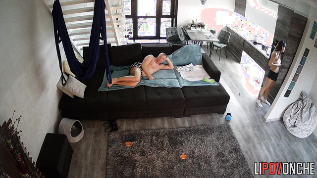 Couple kissing on the huge sofa - watch this cool video