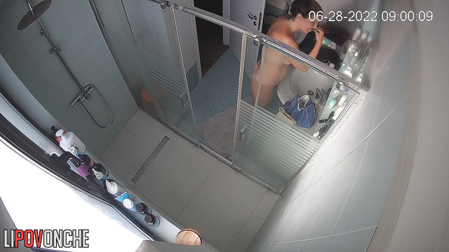 Tanned brunette with big tits took a shower in the bathroom