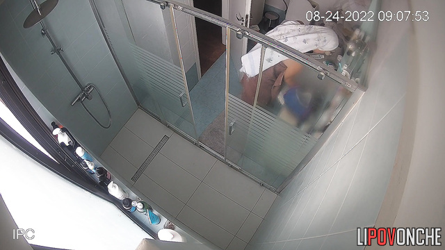 The tanned brunette went to the toilet and took a shower