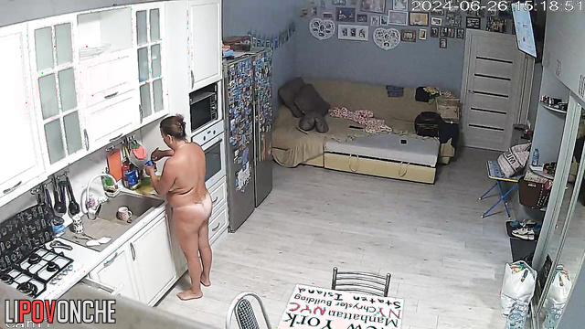 Naked milf preparing dinner with an oven (kitchen video)