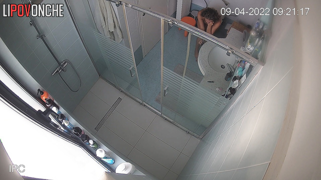 The naked brunette sat on the toilet with the phone for a long time