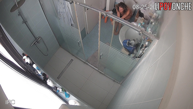 Brunette uses the toilet in the bathroom and takes care of herself