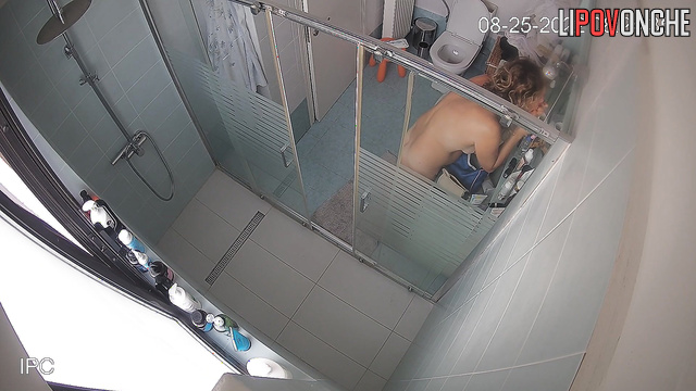 Brunette uses the toilet in the bathroom and takes care of herself