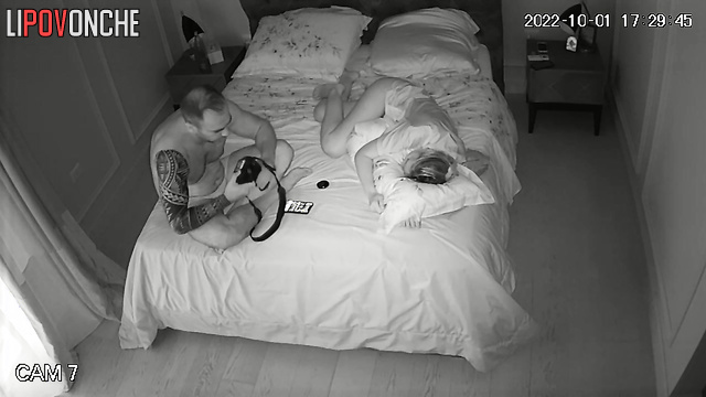 Couple having a nice conversation on the bed in the bedroom