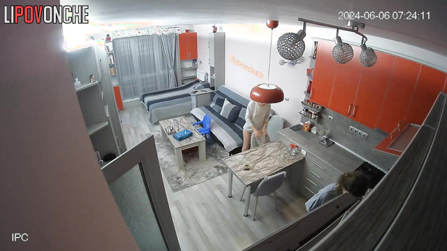 Brunette with small tits talking to her friend in the living room