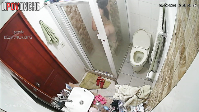 Brunette shaves in the bathroom and takes a shower