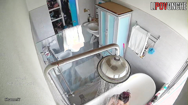 Mature MILF takes a shower and masturbates while sitting in the bathtub
