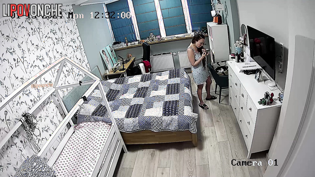 Long-haired brunette dressing and wants being spied