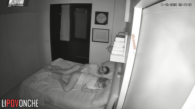 Man watching tv and teasing her at the same time