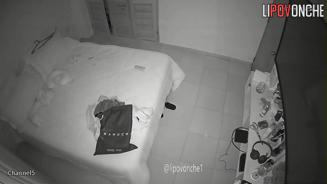 A big-breasted woman completely undresses before going to bed