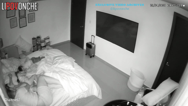 Parents kissing and hugging on the bed right now