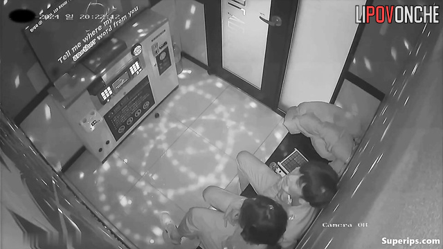 Asian couple kissing tenderly in a karaoke club