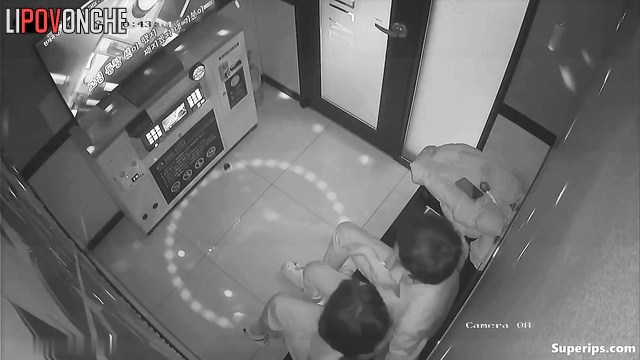 Asian couple kissing tenderly in a karaoke club