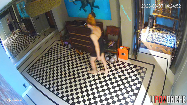 Couple dressing fast in the corridor (live video)