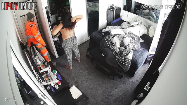 Brunette kissing her husband (he went from work)