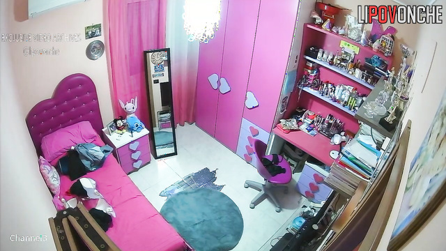 Cute brunette dressing in her cute pink room, watch