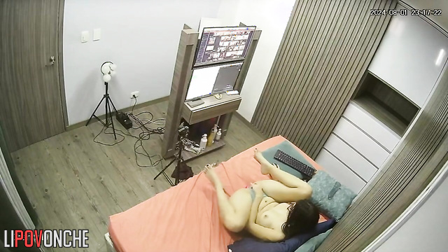 Long-haired brunette masturbating on webcamera