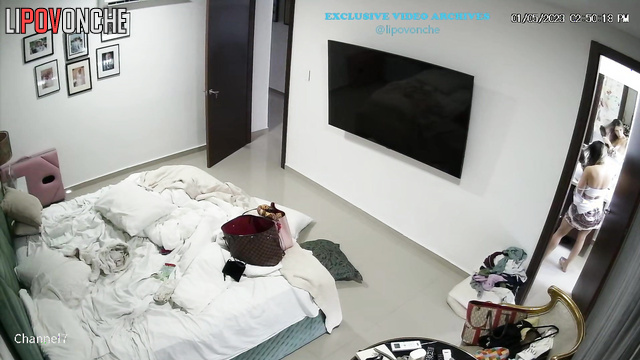 Naked couple watching interesting film under the blanket