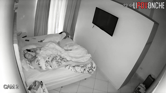 Couple tenderly hugging each other in their sleep