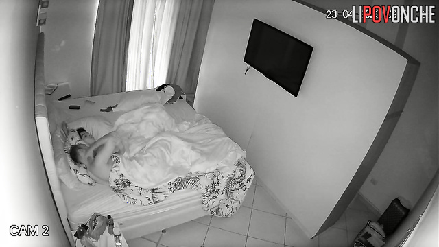 Couple tenderly hugging each other in their sleep