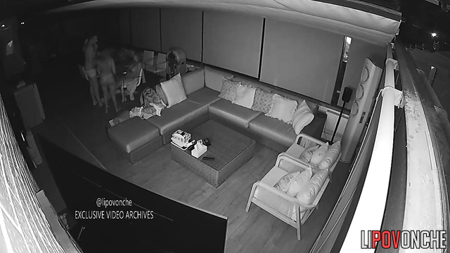 Topless babes and guy chatting in the living room