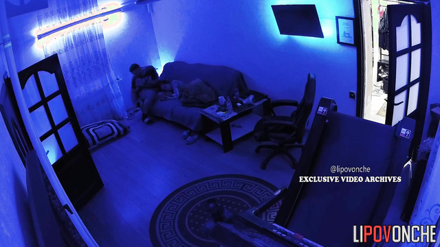 Naked couple enjoying each other in the living room