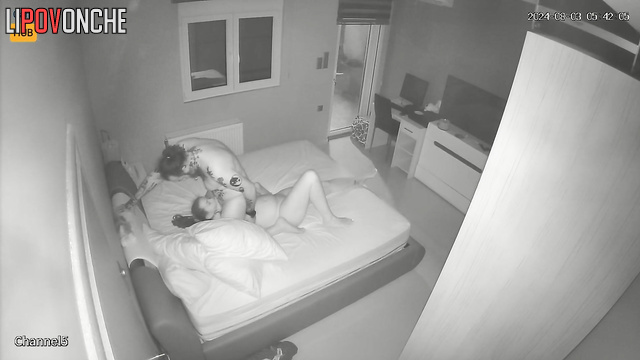 Naked tattooed couple making each other hot in the bedroom