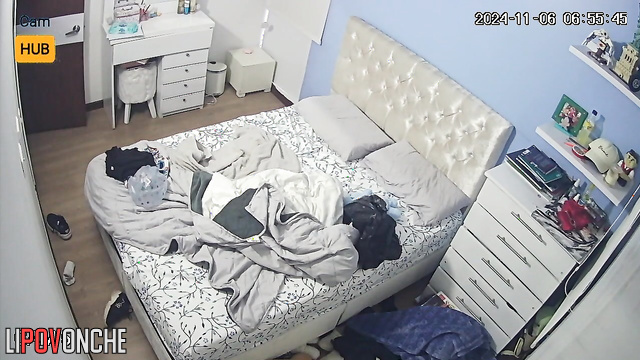 Cute brunette dressing after long sleep, video from bedroom