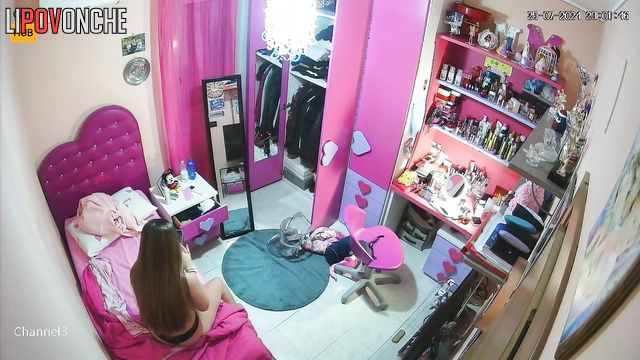 Long-haired skinny girl looking at her sexy body in mirror