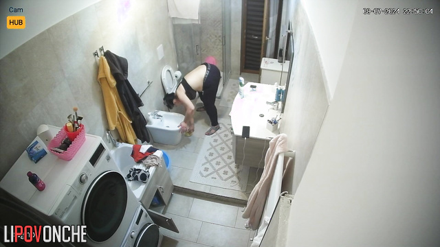 Chubby woman sitting on the toilet and listening to music