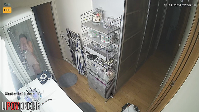 She washes herself and does not suspect that she is being watched