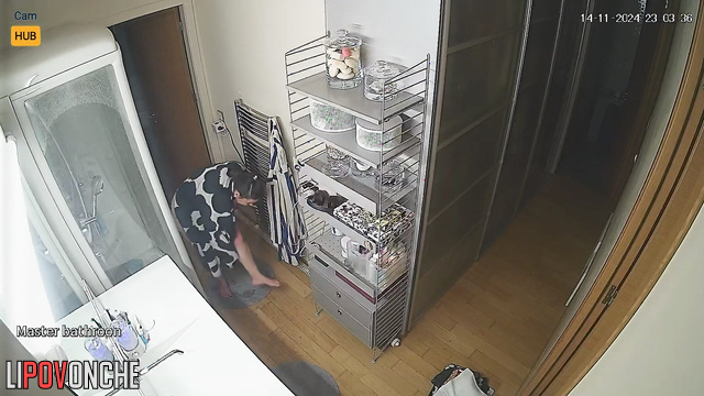 She washes herself and does not suspect that she is being watched