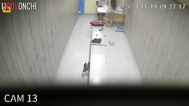 Long-haired russian girl changing clothes in the locker room