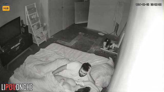 Bearded guy teasing her sweet girlfriend on the bed